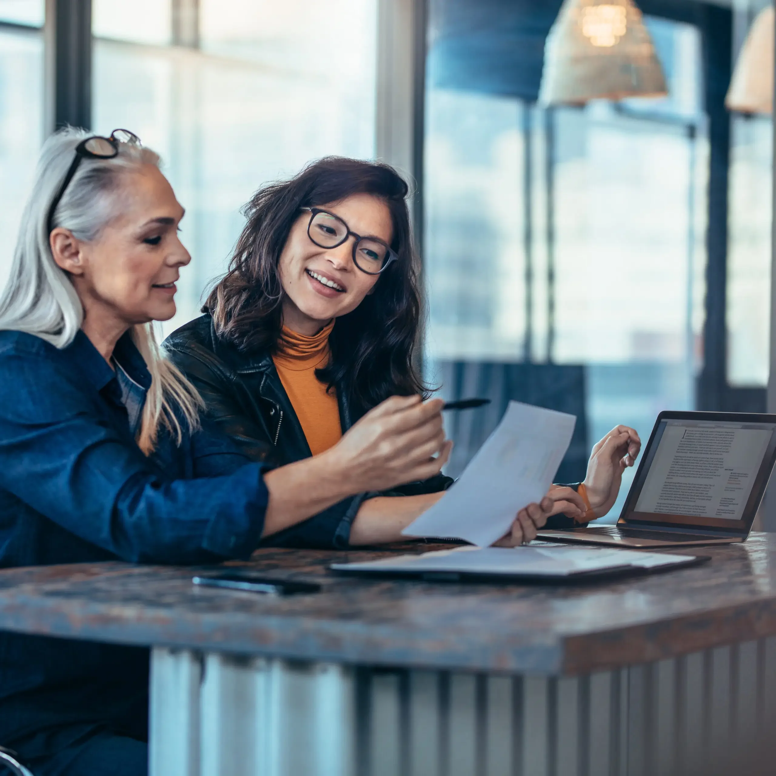 GettyImages-1018188310-scaled-square-4e9f0840b13b796a00ead9bfbc7af9cb-k7p6d43t5sgz Two businesswomen reviewing documents together.