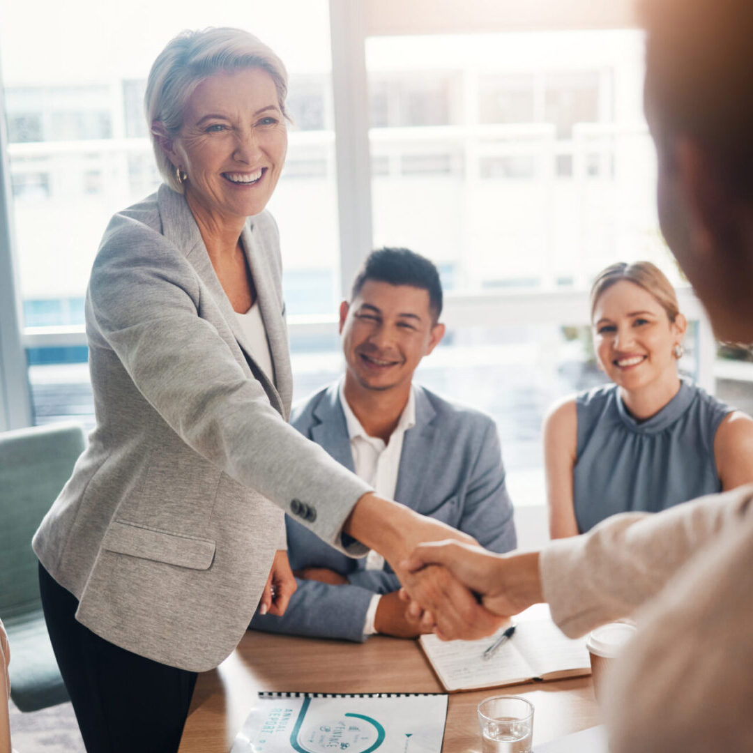 B2b meeting, success or business people shaking hands after a contract agreement for working together. Diversity, company and happy management welcome a worker in a new partnership deal in office